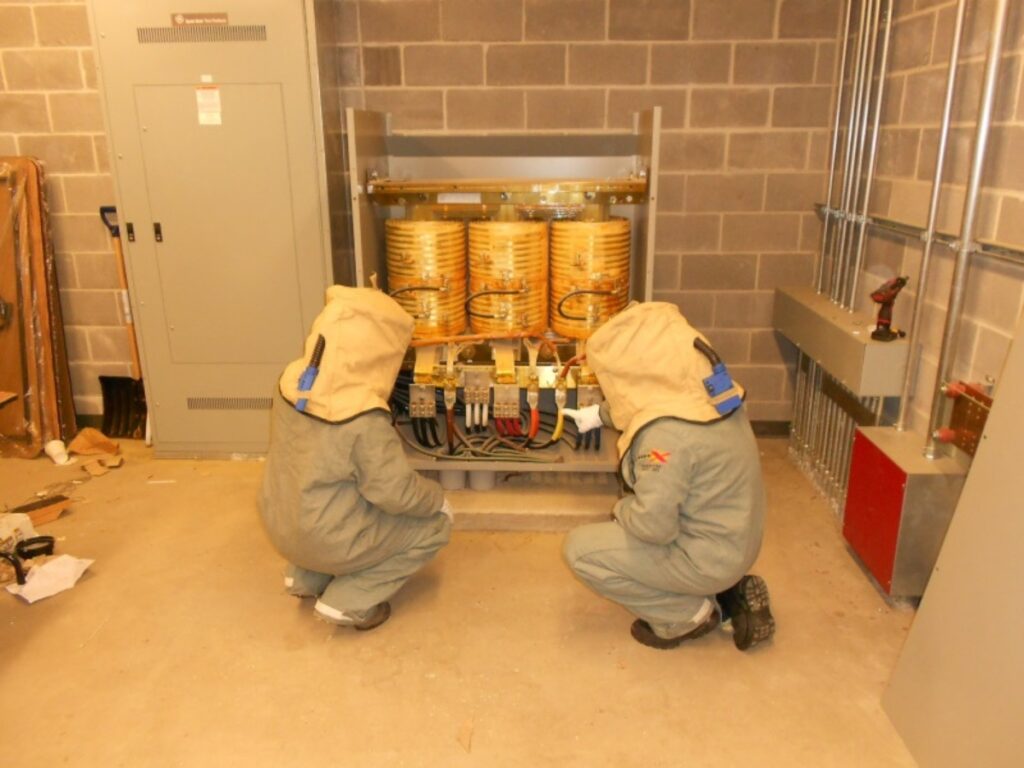 two man checking electrical system